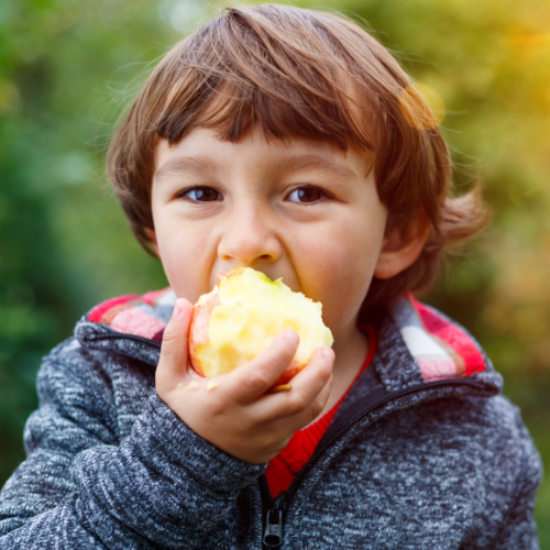 Child eating fresh fruit